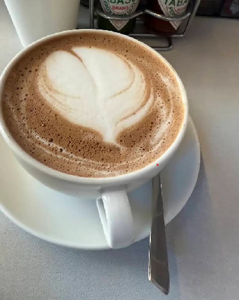 A cappuccino with latte art at Caffix